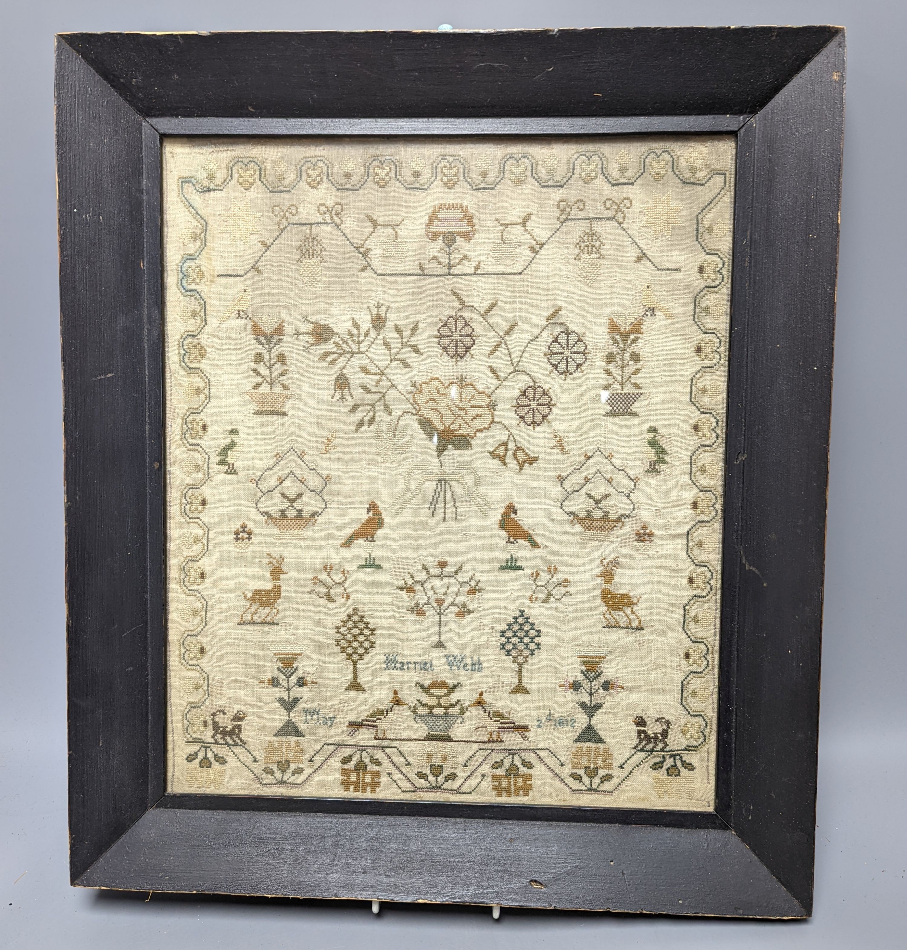A dated 1812 sampler by Harriet Webb, framed 37x31cm excl frame